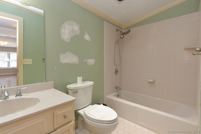 full bathroom featuring lofted ceiling, tiled shower / bath combo, vanity, ornamental molding, and toilet