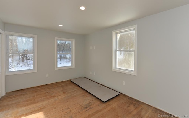 unfurnished room featuring light wood-type flooring