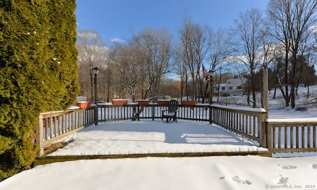 view of snow covered deck