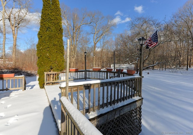 view of snow covered deck