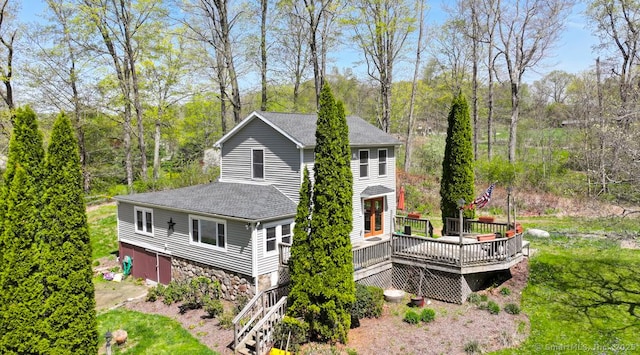 79 Jacob Rd, Southbury, CT 06488 - view of side of property with a shingled roof, a wooden deck, and stone siding