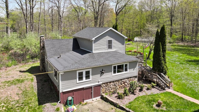 79 Jacob Rd, Southbury, CT 06488 - view of side of property featuring stairs, a shingled roof, a deck, a view of trees, and a chimney