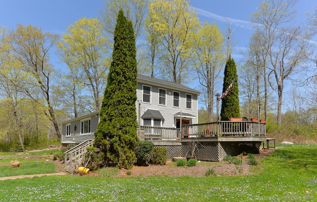 79 Jacob Rd, Southbury, CT 06488 - rear view of property with a lawn and a deck