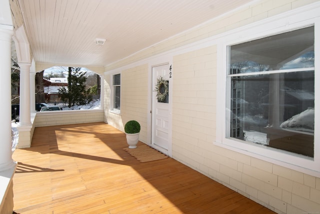 wooden deck featuring covered porch