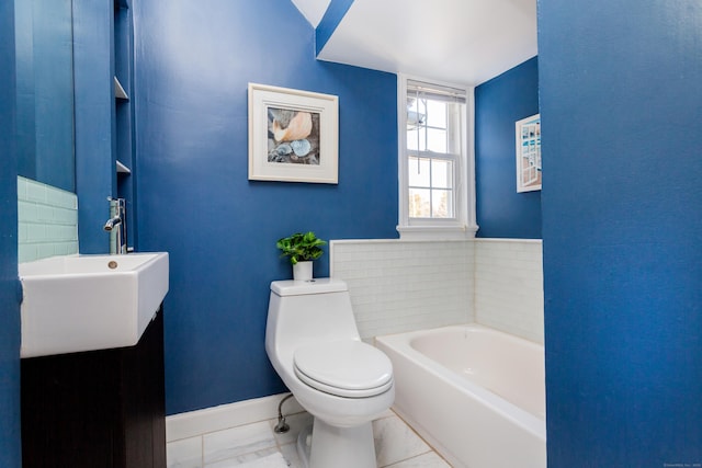 bathroom featuring toilet, a bathing tub, and sink