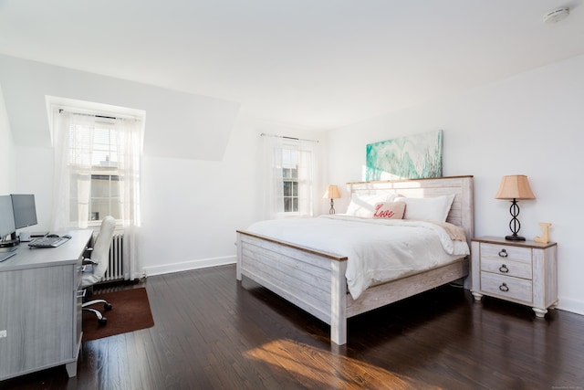 bedroom featuring dark hardwood / wood-style flooring and radiator