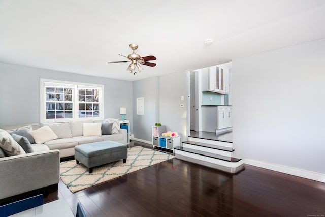 living room featuring hardwood / wood-style flooring and ceiling fan