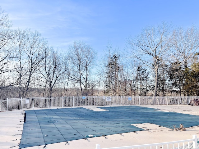 pool featuring a patio area and fence