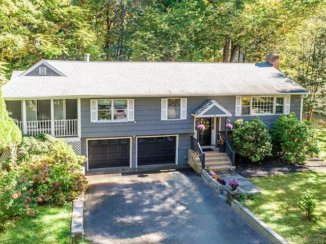 bi-level home featuring a garage