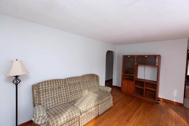 sitting room with wood-type flooring