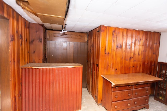 bar featuring wood walls