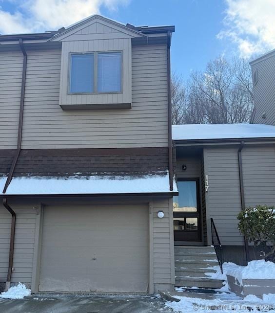 view of front of property with a garage