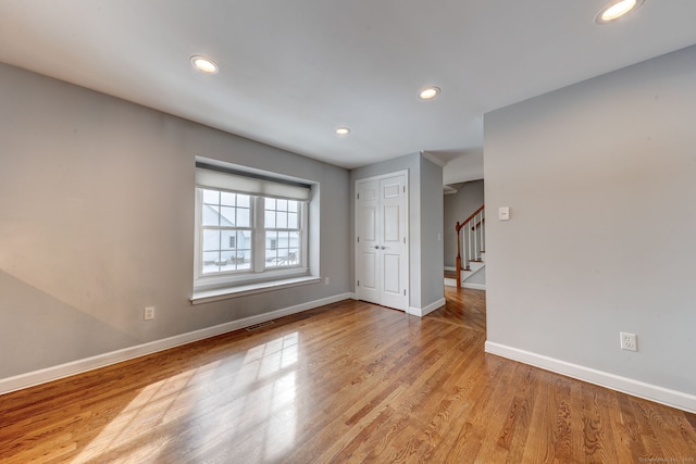 unfurnished room featuring light wood-type flooring