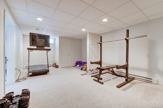 workout area featuring carpet flooring and a drop ceiling