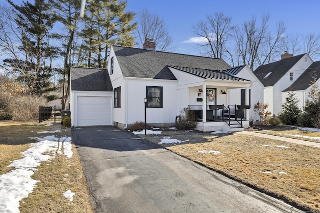 view of front of home with a garage and covered porch