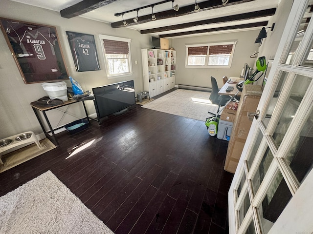 office area featuring beamed ceiling, a baseboard radiator, a healthy amount of sunlight, and wood-type flooring