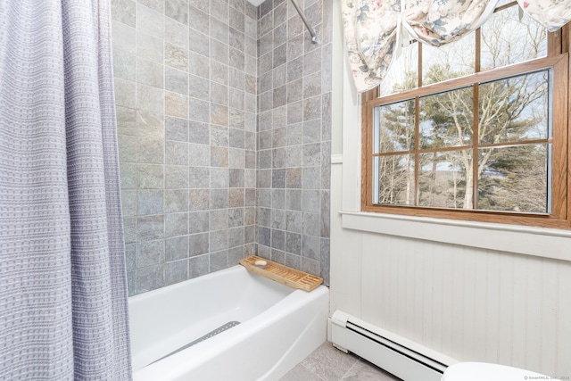 full bathroom featuring baseboard heating and shower / tub combo with curtain