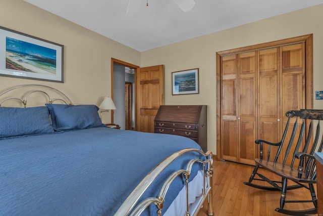 bedroom with ceiling fan, a closet, and light hardwood / wood-style flooring