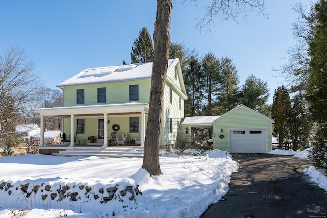 view of front of property featuring a garage and covered porch