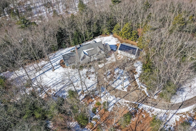 birds eye view of property with a forest view