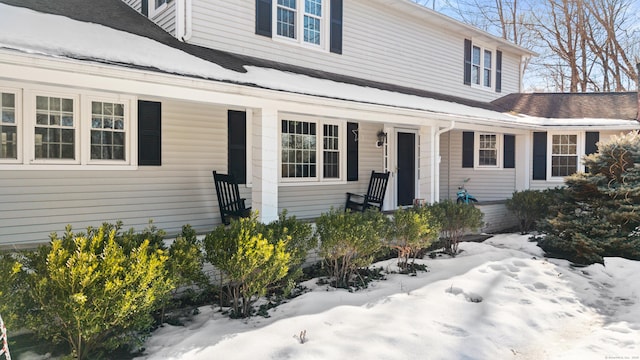 view of snow covered property entrance