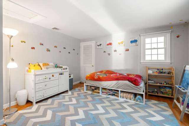 bedroom featuring attic access and visible vents