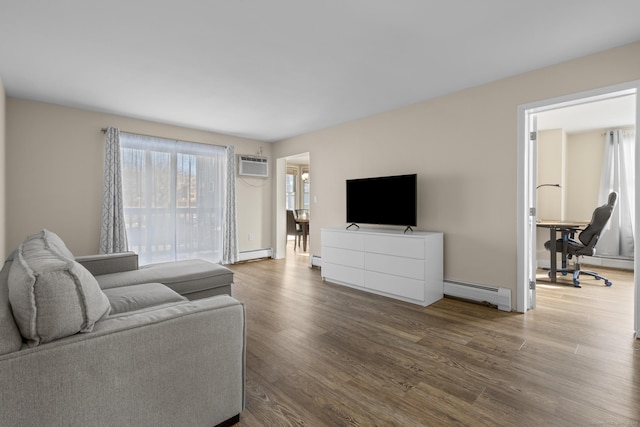 living area with a wall unit AC, a baseboard radiator, baseboard heating, and wood finished floors