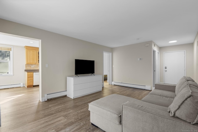 living room with light wood finished floors, a baseboard radiator, and baseboard heating