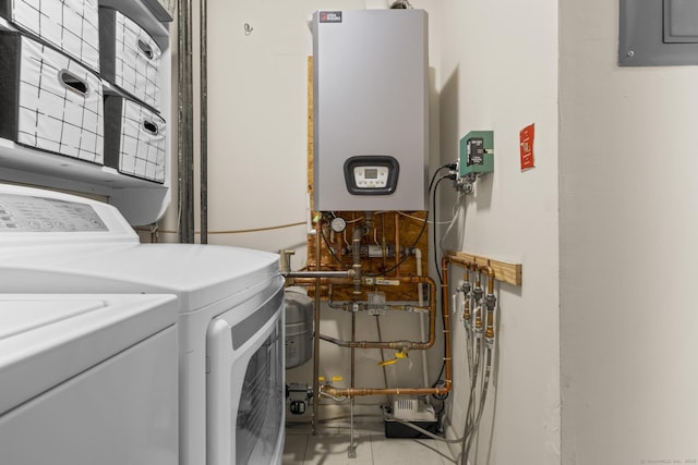 washroom with water heater, laundry area, independent washer and dryer, and electric panel