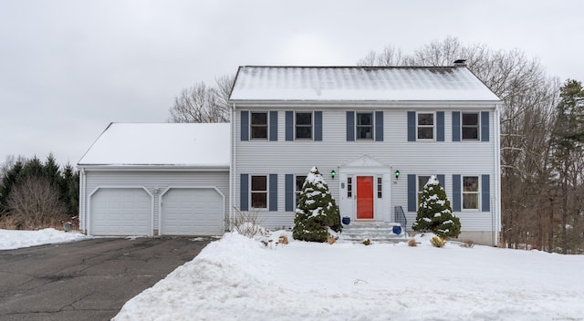 colonial inspired home featuring a garage