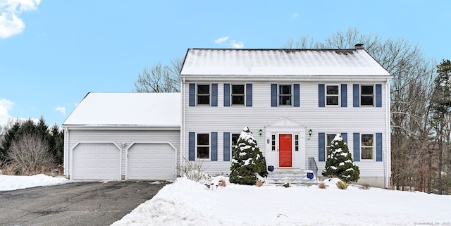 colonial home featuring a garage