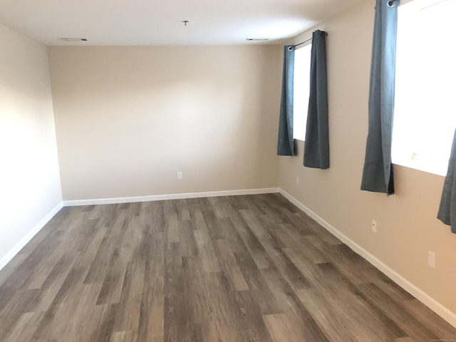 empty room featuring dark hardwood / wood-style floors