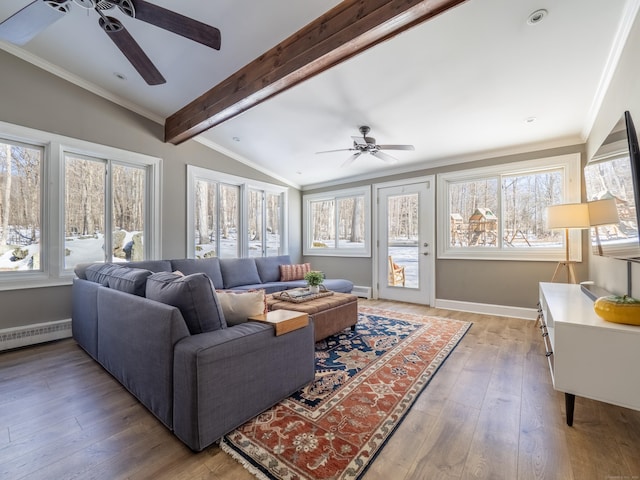 living area featuring lofted ceiling with beams, a baseboard heating unit, ornamental molding, and wood finished floors