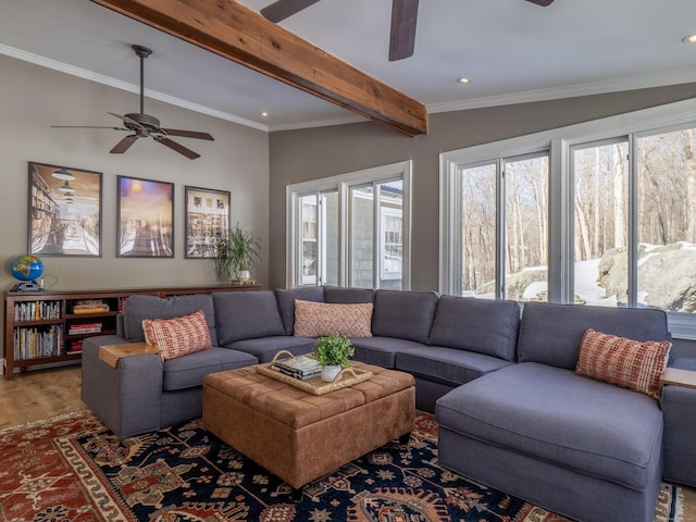 living area featuring a ceiling fan, ornamental molding, beamed ceiling, wood finished floors, and recessed lighting