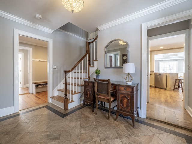 interior space featuring stairway, baseboards, and ornamental molding