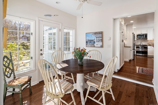 dining space with a ceiling fan, dark wood-type flooring, recessed lighting, and baseboards