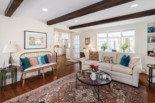 living room with recessed lighting, beamed ceiling, baseboards, and wood finished floors