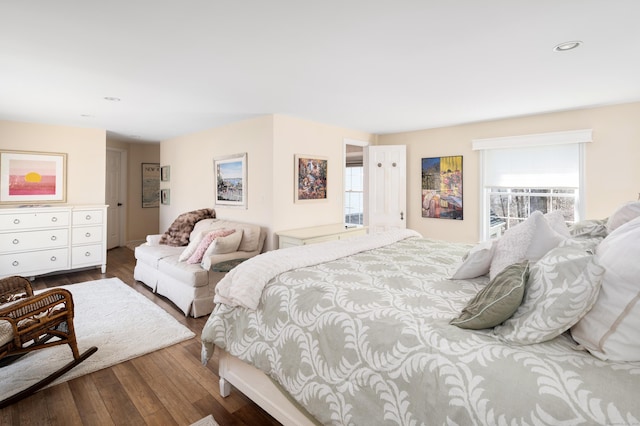 bedroom featuring recessed lighting and wood finished floors