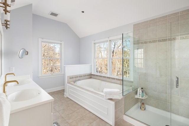 bathroom featuring a sink, visible vents, vaulted ceiling, a shower stall, and double vanity