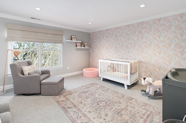 bedroom with carpet, baseboards, visible vents, and ornamental molding