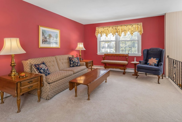 living room featuring a baseboard heating unit and carpet