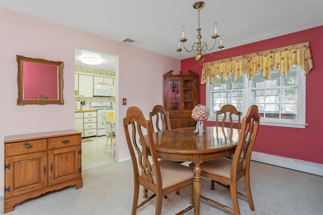 dining area featuring light colored carpet, visible vents, a chandelier, and baseboards