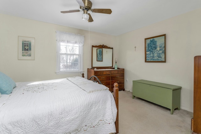 bedroom featuring light colored carpet and ceiling fan