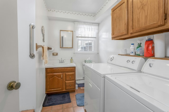 clothes washing area featuring a sink, separate washer and dryer, and light tile patterned floors