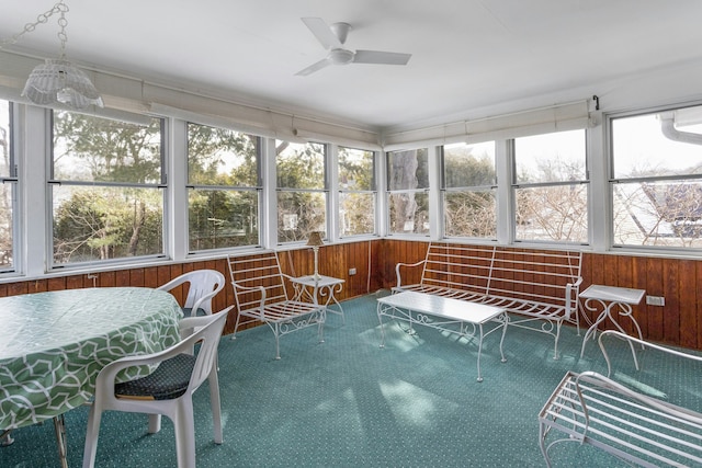 sunroom with a ceiling fan