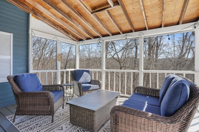 sunroom with vaulted ceiling and a wealth of natural light