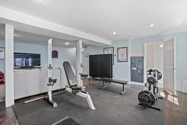 workout area featuring baseboards and recessed lighting