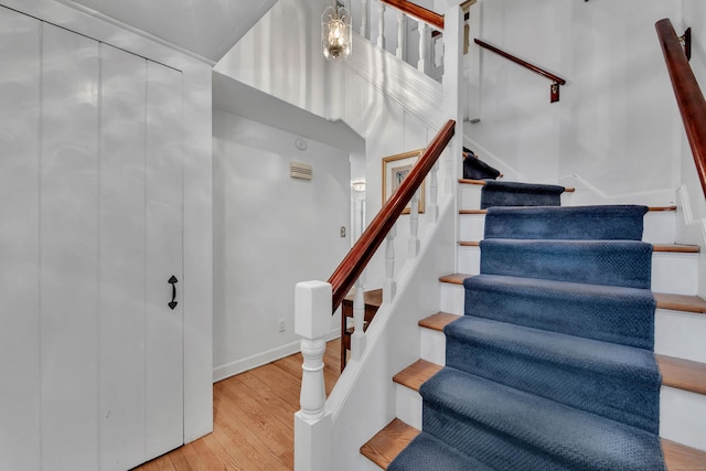 stairway featuring hardwood / wood-style flooring