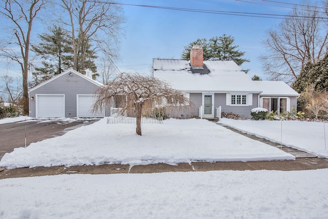 view of front of home featuring an outbuilding and a garage