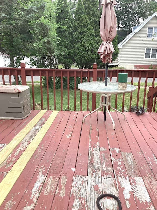 deck featuring a lawn